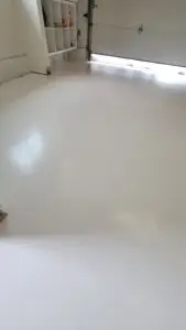 Minimalist matte white epoxy flooring for garage