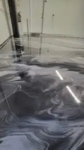 Custom metallic epoxy flooring with flowing patterns