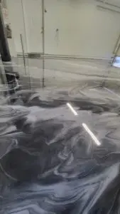Metallic epoxy garage floor with custom marble-style design