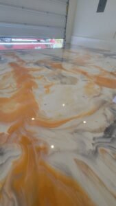 High-gloss metallic epoxy flooring with artistic finish