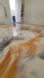 Luxury metallic epoxy floor with silver and gold tones
