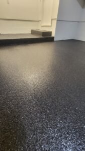 Black full flake epoxy garage floor with high-gloss finish